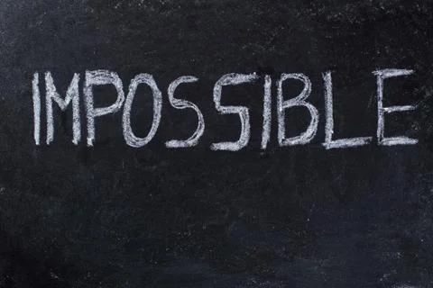 Impossible written on blackboard Stock Photos