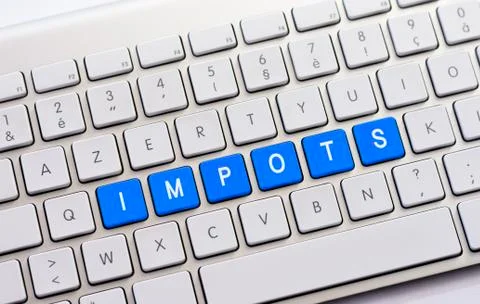 IMPOTS writing on white keyboard Stock Photos