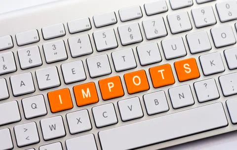 IMPOTS writing on white keyboard Stock Photos