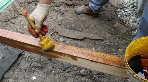 Impregnation of a wooden structure with a protective solution Stock Photos