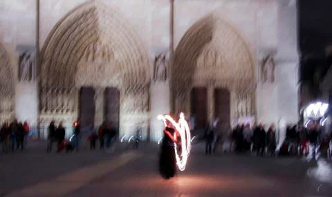 Impression: fire juggler performing in front of the night crowd in Paris, Fra Photos