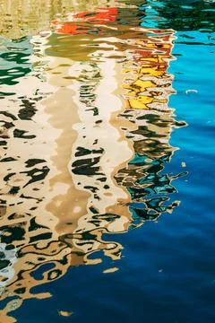 Impressionistic background of wave ripples reflecting urban architecture al.. Stock Photos