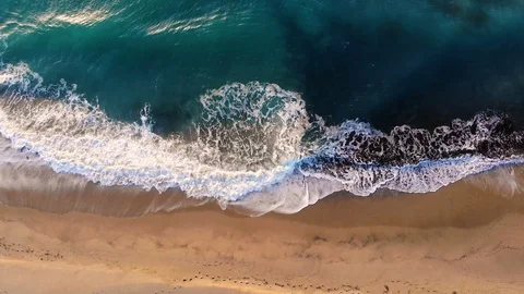 Impressive aerial view of splashing waves motion over turquoise blue sea surface Stock Footage 120671112