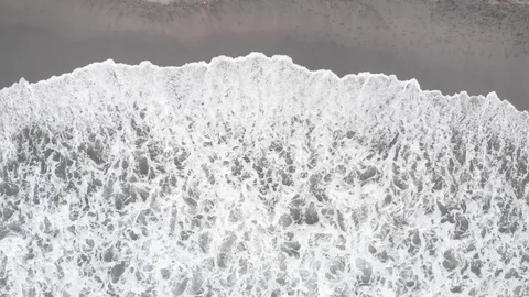 Impressive aerial view of the waves breaking on the beach Stock Footage 126009792