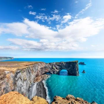 Impressive andscape with unique basalt arch on Dyrholaey Nature Reserve on .. Stock Photos