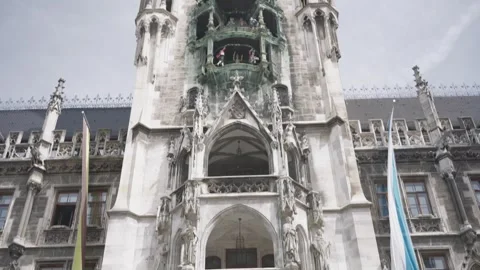 Impressive architecture of the new town hall with its famous glockenspiel at Stock Footage 334307041