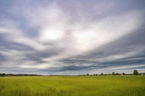 An impressive Asperitas cloud formation over green agricultural fields Stock Photos