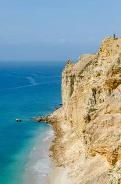 Impressive cliffs with turquoise ocean at the coast at Caotinha, Angola Stock Photos