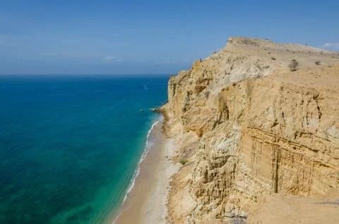 Impressive cliffs with turquoise ocean at the coast at Caotinha, Angola Stock Photos