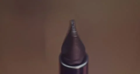 An Impressive CloseUp of a Sharpened Pen Tip, Perfect for Various Artistic Stock Footage 297952560