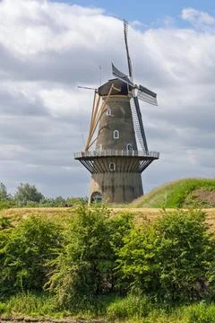 The impressive "De Hoop" windmill on a dike in Gorinchem, Netherlands, stands Stock Photos