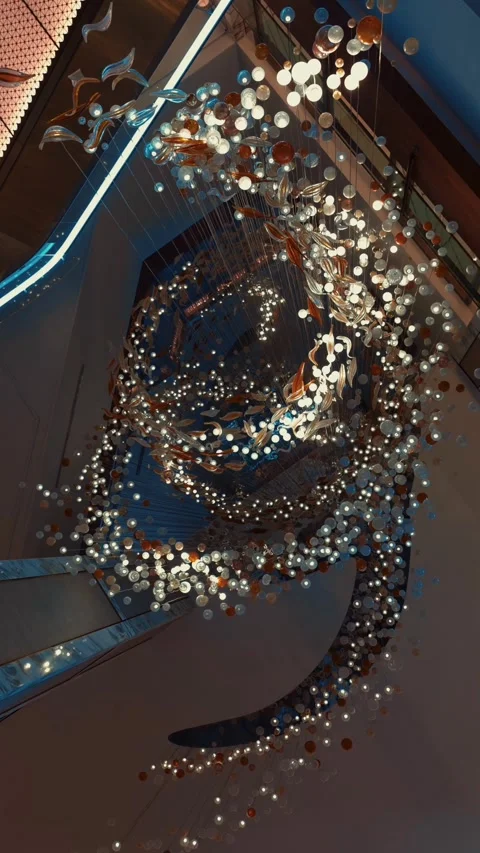 An impressive decorative chandelier displayed inside a luxury hotel lobby in Stock Footage 346445376