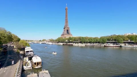 Impressive Eiffel Tower and Seine river in Paris in a sunny day with blue sk Stock Footage 191986281