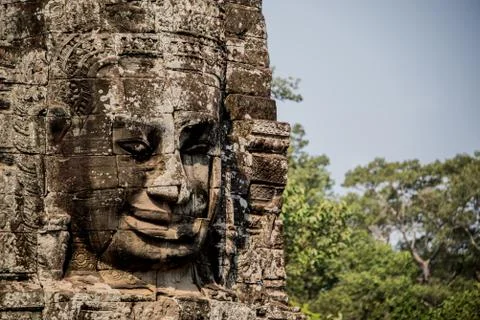 Impressive face sculpture at Angkor Thom.  Stock Photos