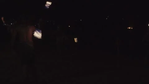 An impressive fire dancing crew spitting large balls of flames into the Stock Footage 199600996