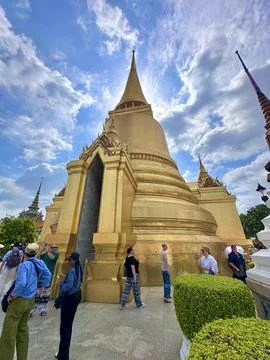 Impressive low-angle view of the massive glittering golden Phra Siratana Stock Photos