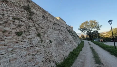 Impressive medieval stone walls under a clear sky 動画素材 346604271