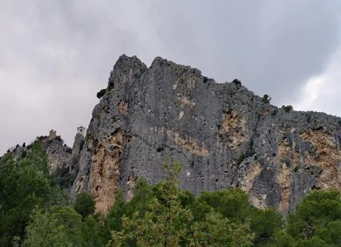Impressive Monolithic Limestone Formation Rising Dramatically Over Lush Pine Stock Photos