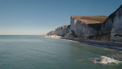 Impressive Normandy's white cliff, round pebbles and green pasture France Stock Footage 240993236