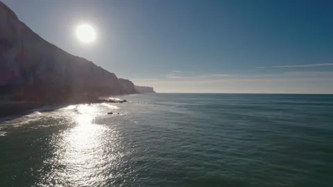 Impressive Normandy's white cliff, round pebbles and green pasture France Stock Footage 240996748