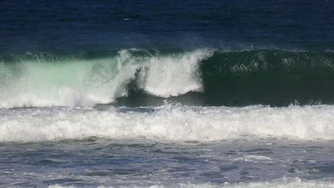 Impressive oceanic waves  exploding on the shore of a small island Stockbeeldmateriaal 108041397