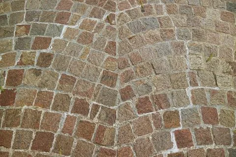 Impressive pattern of a stone path in the city Photos