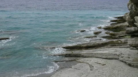Impressive rocks falling into the ocean, in Basque Country, in France Stock Footage 198915971