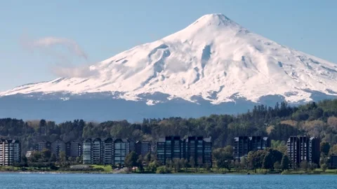 Impressive shot of a housing complex surrounded by vegetation and at the fo.. Stock Footage 289741913