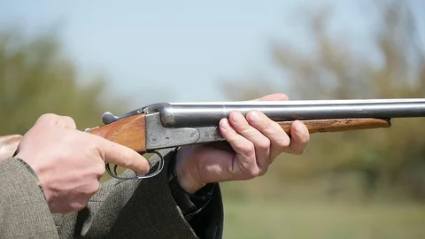 Impressive skeet shooting on a green range on a sunny day in summer Stock Footage 89825991