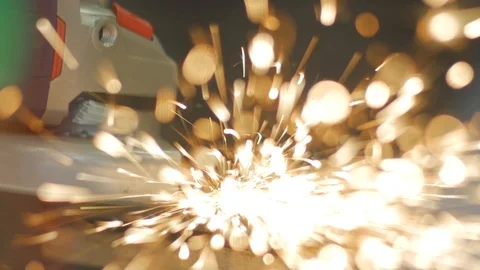 Impressive spark shower of angular grinder. A metal worker is cleaning the Stock Footage 116044456