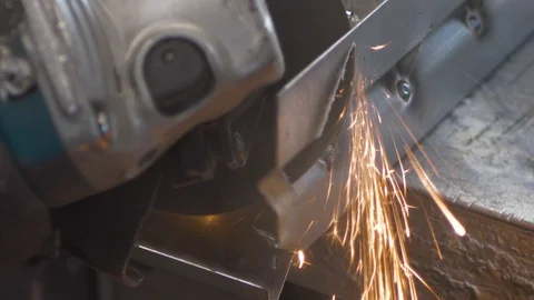 Impressive spark shower of angular metal cutting. A metal worker is Stock Footage 128212268
