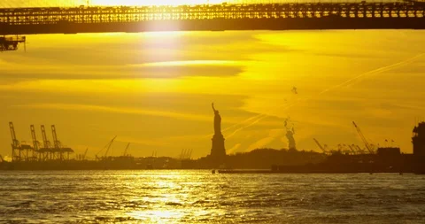 The Impressive Statue Of Liberty Silhouette At Sunset On Iconic Hudson River NYC Stock Footage 112220821