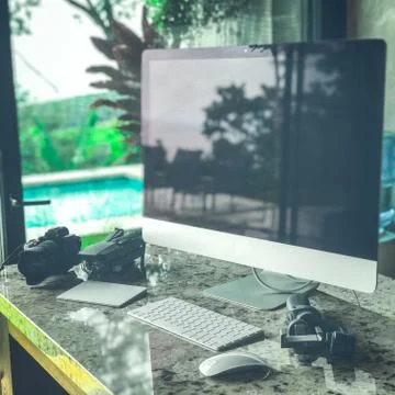 Impressive studio with computer Mirroless camera Drone and photo equipment Stock Photos