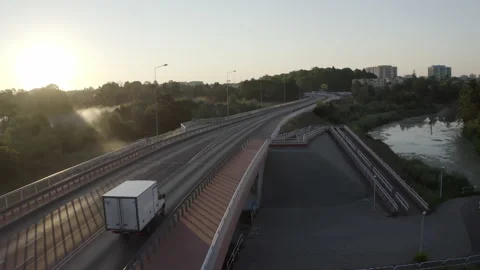 Impressive Three Lane Bridge Above Calm River Against Beautiful Sunrise Stock Footage 138519782