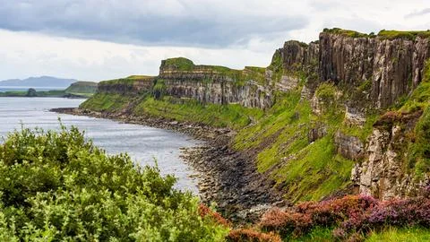 Impressive vertical-walled cliffs on the Scottish island of Skye, UK. Stock Photos
