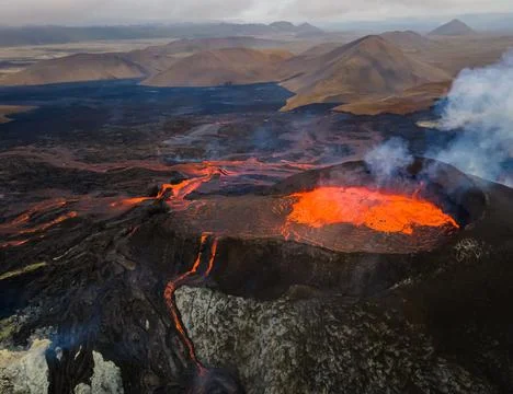 Impressive view of the exploding red lava of the Active Volcano Stock Photos