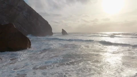Impressive view of waves crashing on cliffs in Portugal when the sun is shi.. Stock Footage 240632108