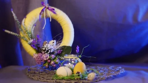 An Impressive Yellow Ring Hanging Over Easter Hen and Quail Eggs on a Round Video stock 72881926