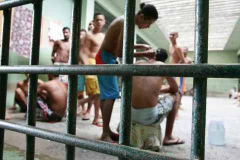 Imprisoned in jail cell Stock Photos