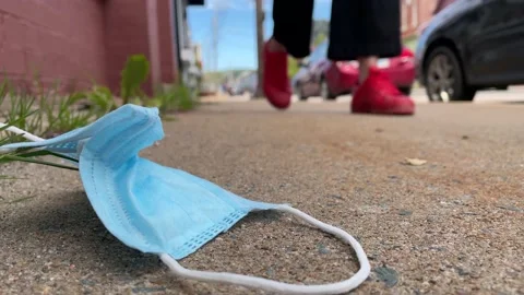 Improperly disposed of face mask Stock Footage 155171861
