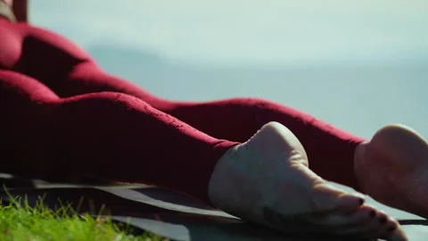 Improve flexibility and strength with outdoor yoga session by a woman Stock Footage 310221854