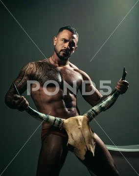 Improving male sexual performance. Sexy hispanic macho with muscular body and Stock Photos