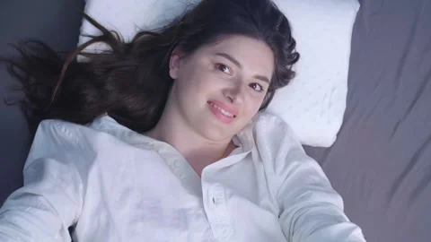 Improving sleep quality with a memory foam pillow, helping with migraines by sup Stock Footage 299722413