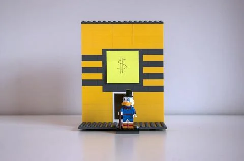 An improvised lego structure of Uncle Scrooge at his money bin. Stock Photos