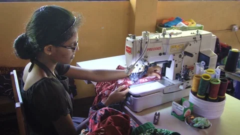Inappropriate Working Conditions in Developing Countries. Woman Sewing at Stock Footage 73599023