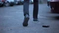 Inattentive male dropping wallet, guy taking purse on street, urban lifestyle 4k or 4k+ Resolution