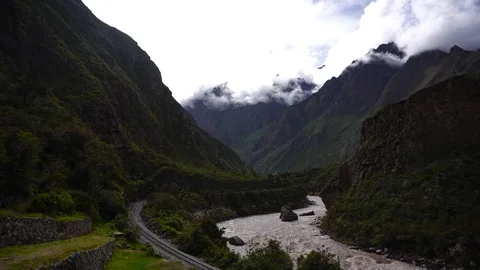 Inca Ruins, Train Rails &amp; River In Mountain Valley [Timelapse] Stock Footage 88390669