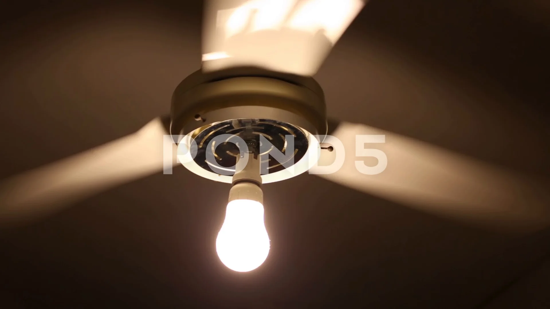 ceiling fan burning light bulbs