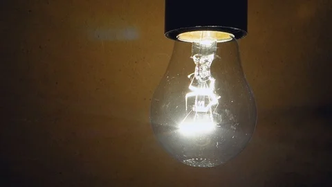 Incandescent bulb hanging down, close-up. Video stock 103675257