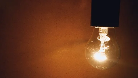 Incandescent bulb hanging down, close-up. Video stock 104130252